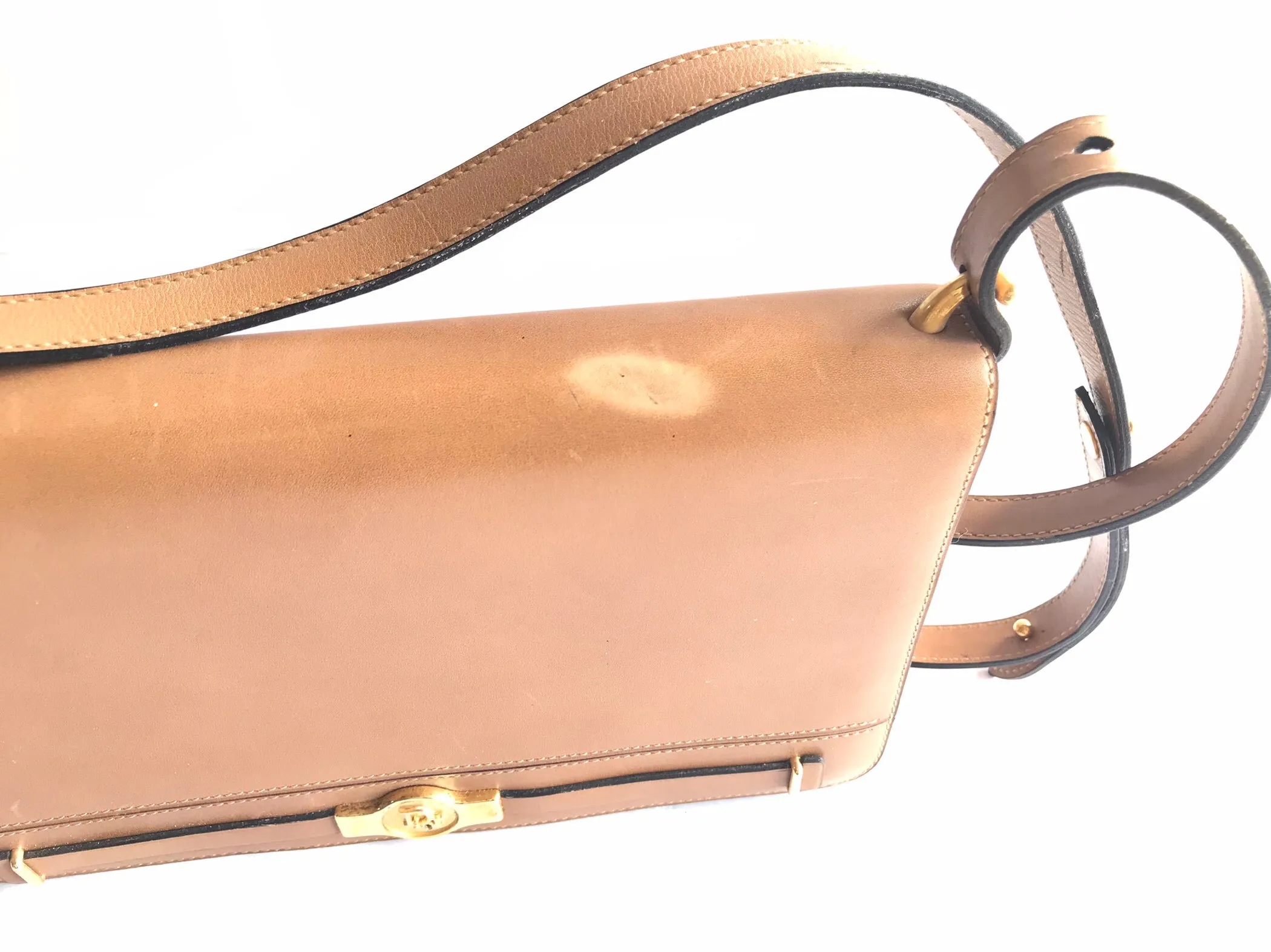 Vintage Christian Dior tanned brown leather shoulder clutch bag with golden CD motif.