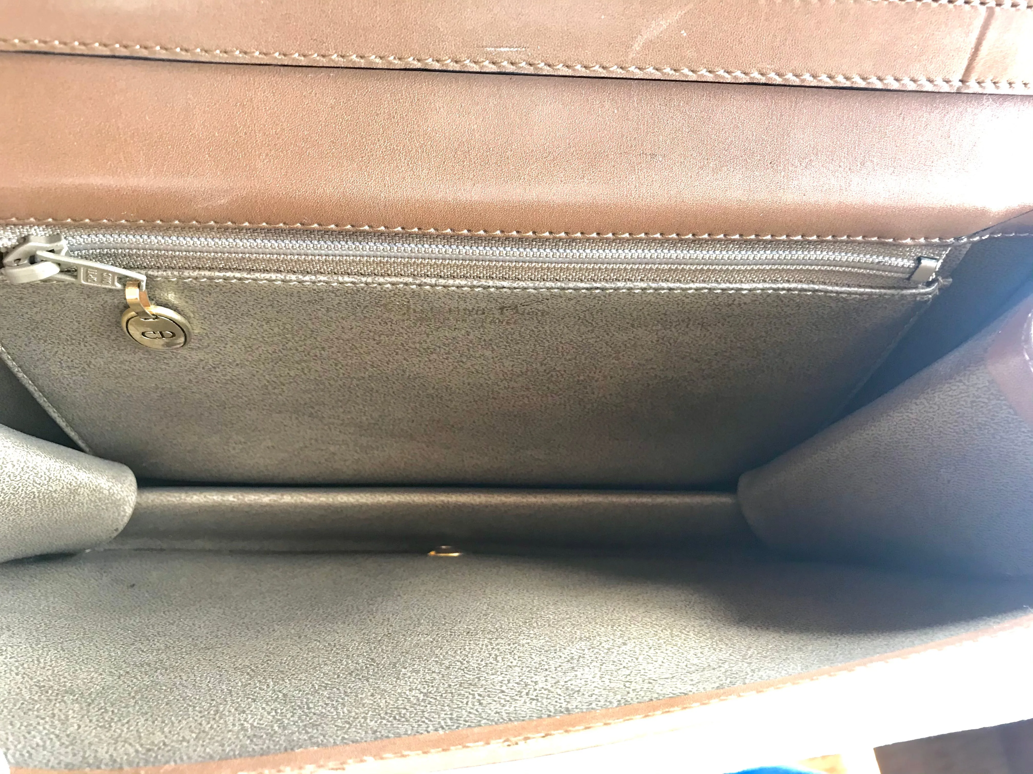 Vintage Christian Dior tanned brown leather shoulder clutch bag with golden CD motif.