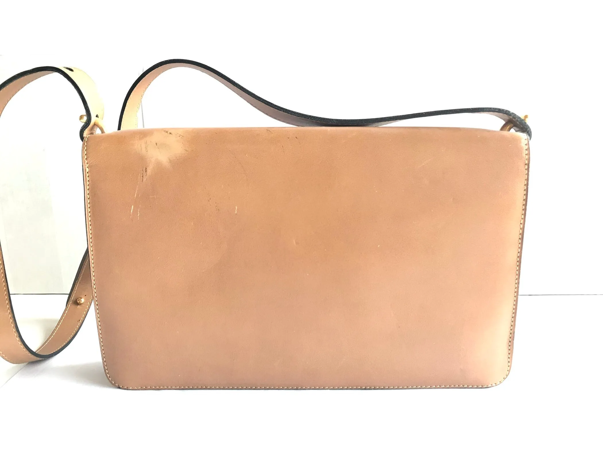 Vintage Christian Dior tanned brown leather shoulder clutch bag with golden CD motif.