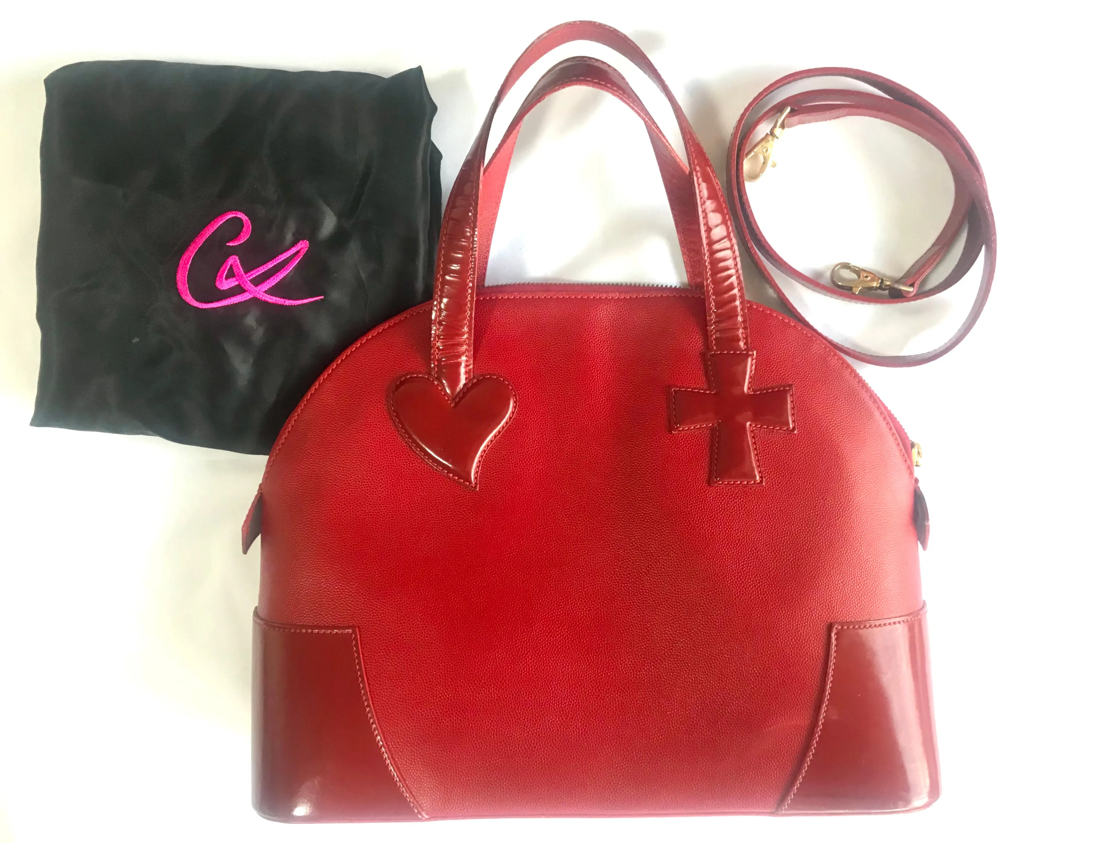 Vintage Christian Lacroix red patent enamel and leather bolide bag with golden logo zipper charm. Comes with shoulder strap. 0403172